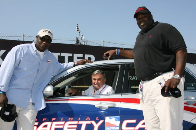 Fan pose with Al Unser Sr.before the Detroit Indy Grand Prix on Race day. -- Photo by: Chris Jones