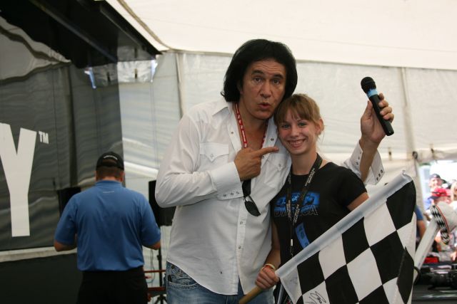 Gene Simmons poses with a fan during a visit to the Indy Downforce tent before the Detroit Indy Grand Prix on Race day. -- Photo by: Chris Jones