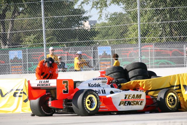Pole-setter, Helio Castroneves makes contact with tire barrier during race action. -- Photo by: Chris Jones