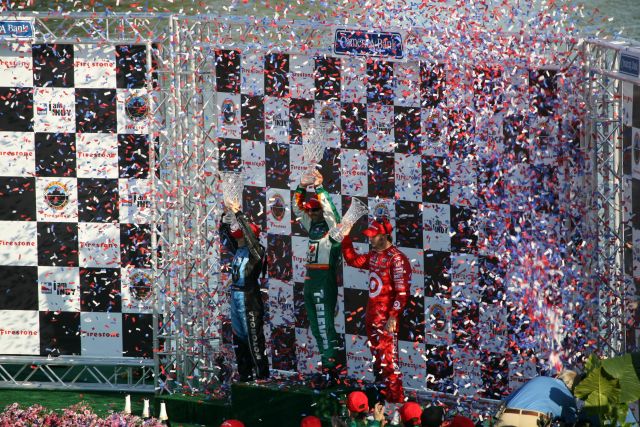 Confetti flies as as podium finishers, Tony Kanaan, Danica Patrick & Dan Wheldon receive their trophies. -- Photo by: Chris Jones