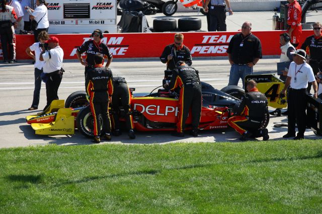 Crew for the No. 4 car prepares it for the Detroit Indy Grand Prix on Race day. -- Photo by: Shawn Payne