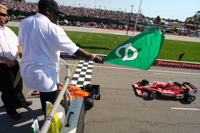 Joe Dumars, HOF & President of Basketball Ops., DP. waves the green flag for the Detroit Indy Grand Prix on Race day. -- Photo by: Shawn Payne