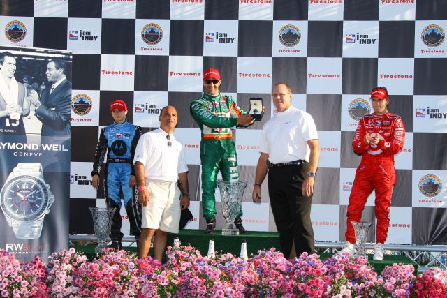 Race winner Tony Kanaan is presented with Raymond Weil watch during podium ceremonies. -- Photo by: Shawn Payne