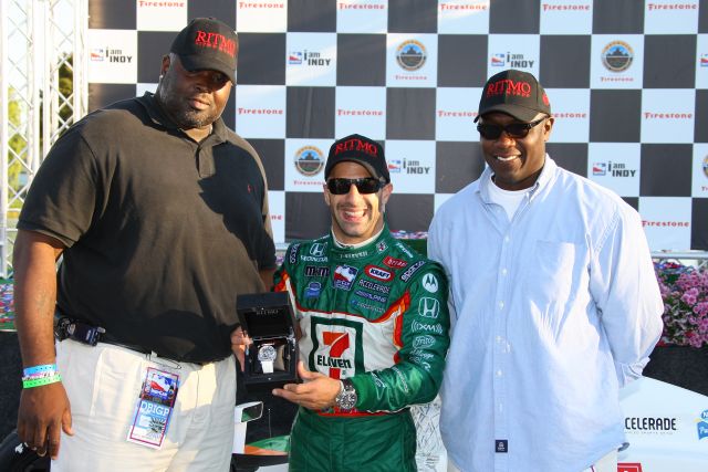 Tony Kanaan, winner of the Detroit Indy Grand Prix, posing with members of the RITMO Watch Company. -- Photo by: Shawn Payne