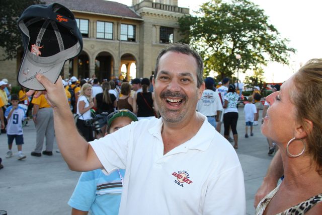 An extremely happy fan displays his recently autographed hat in Detroit on race day. -- Photo by: Shawn Payne