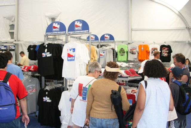 Race fans stop in at IndyCar retail area. -- Photo by: Steve Snoddy