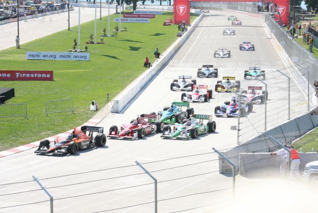 Front of the field tightly makes its way into turn as Dario Franchitti leads the way. -- Photo by: Steve Snoddy