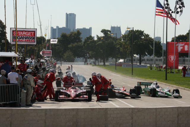 AGR teammates Dario Franchitti and Tony Kanaan race to exit pit area during race action. -- Photo by: Steve Snoddy