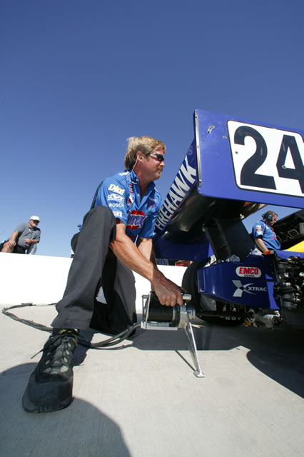 #24 Team Purex Dreyer & Reinbold Racing crew member starts Felipe Giaffone's car -- Photo by: Ron McQueeney