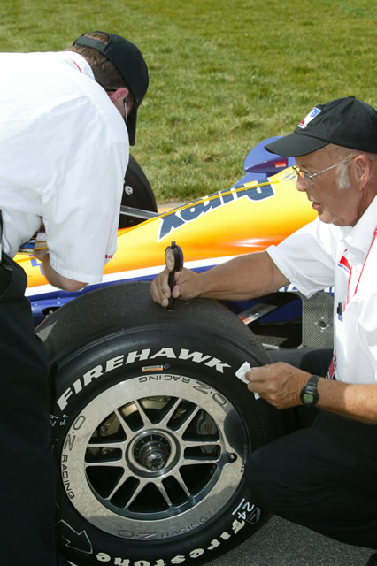 #24 Team Purex Dreyer & Reinbold Racing crew members taking tire readings -- Photo by: Shawn Payne
