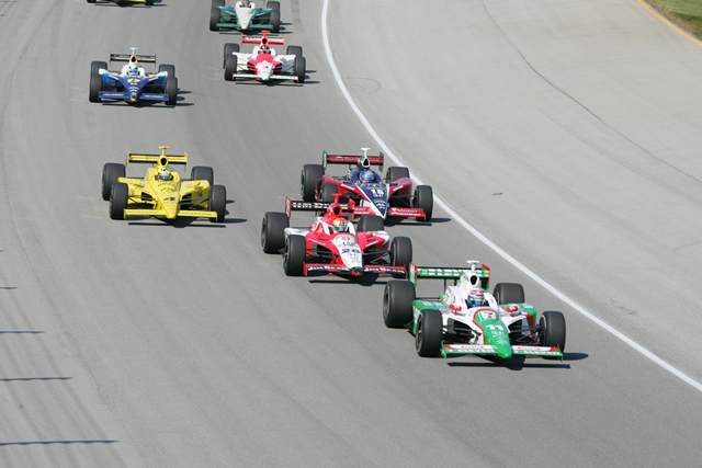 Tony Kanaan, in the No. 11 Team 7-Eleven Dallara Honda, leads the pack followed by Andretti Green racing teammate, Dan Wheldon, in the No.26 Jim Beam/Klien Tools. -- Photo by: Ron McQueeney