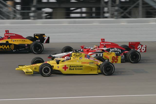 #26 Dan Wheldon squeezes threw teammate #7 Brian Herta and #95 Buddy Lazier during the Peak Antifreeze Indy 300 from Chicagoland Speedway. -- Photo by: Chris Jones