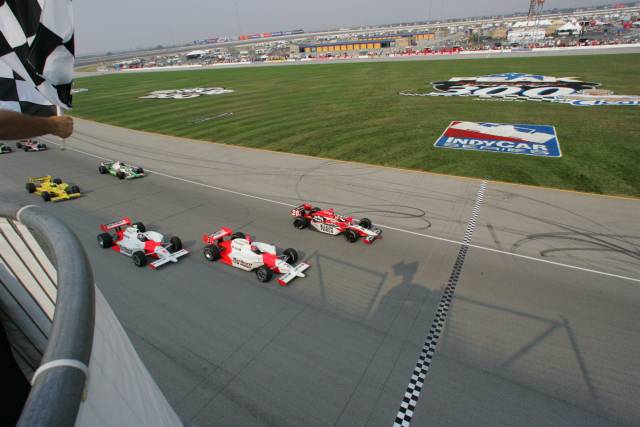 #26 Dan Wheldon leads #3 Helio Castroneves and #6 Sam Hornish Jr. to the finish line at the Peak Antifreeze Indy 300 at Chicagoland Speedway. -- Photo by: Ron McQueeney