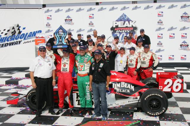 #26 Dan Wheldon, the Andretti Green Racing ownership group and his crew celebrate his victory at the Peak Antifreeze Indy 300 from Chichagoland Speedway -- Photo by: Shawn Payne