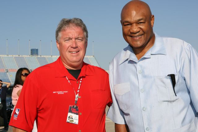 Rev. Bob Hills and George Foreman after the morning service at Chicagoland Speedway -- Photo by: Chris Jones