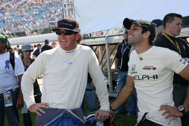 Dreyer & Reinbold driver Buddy Rice, left, talks with Panther Racing driver Vitor Meira prior to start of race. -- Photo by: Chris Jones