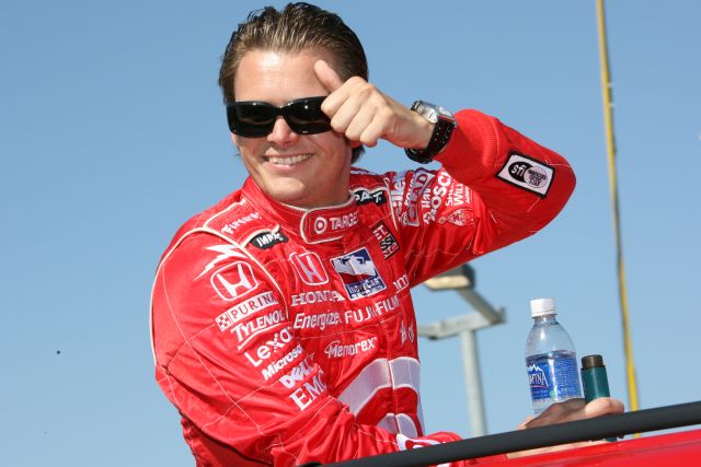 Chip Chip Ganassi driver Dan Wheldon gives the thumbs-up sign to fans. -- Photo by: Chris Jones