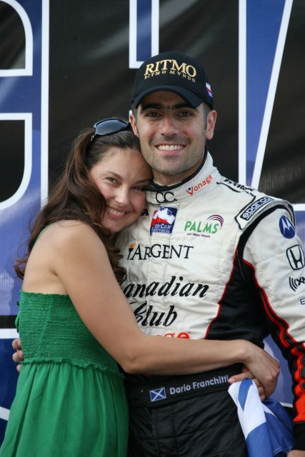 Race and Series winner Dario Franchitti is embraced by wife Ashley Judd upon securing the titleship at Chicagoland Speedway. -- Photo by: Chris Jones