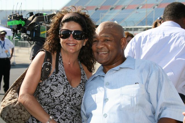 George Foreman poses for pictures with a fan after the morning service at Chicagoland Speedway -- Photo by: Dana Garrett