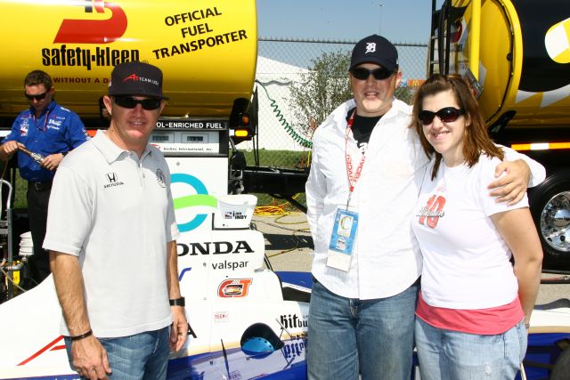 DownForce winner who will have his name on Buddy Rice's car in race at Chicagoland Speedway poses with Buddy Rice and his girlfriend. -- Photo by: Jim Haines