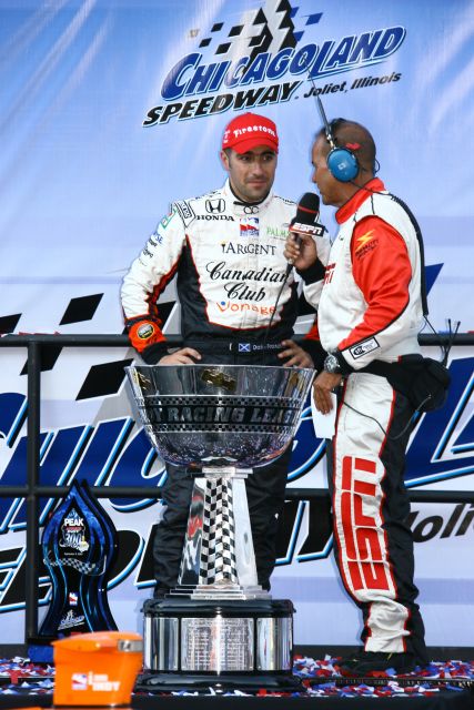 Jack Arte interviews Dario Franchitti after he wins the championship. -- Photo by: Jim Haines