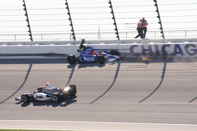 Vision Racing driver Tomas Scheckter maneuvers below AGR driver Marco Andretti after Andretti made contact with outside wall. -- Photo by: Ron McQueeney