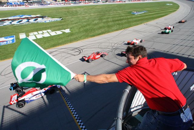 Honorary Starter, Bill Edwards, Director, Merchandising, AutoZone shows-off his flag waving skills as the Peak Antifreeze Indy 300 presented by Mr. Clean event at Chicagoland Speedway is underway. -- Photo by: Shawn Payne