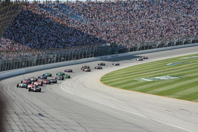 The field of the Peak Antifreeze Indy 300 makes its way out of front stretch after green flag restart. -- Photo by: Steve Snoddy