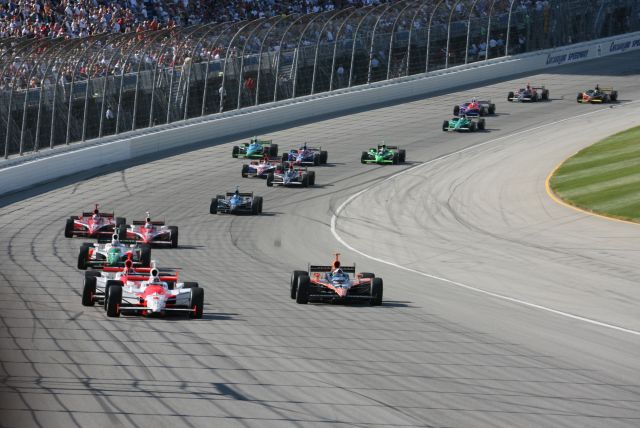 IndyCar Series field makes its way down front stretch into turn 1. -- Photo by: Steve Snoddy