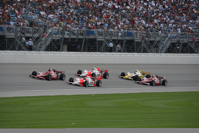 No. 10 Dan Wheldon leads No. 3 Helio Castroneves during the PEAK Antifreeze & Motor Oil Indy 300 at Chicagoland Speedway. -- Photo by: Dana Garrett