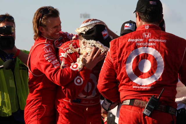 Dan Wheldon treats Scott Dixon to a pie to the face after Scott wins the IndyCar Series championship following the PEAK Antifreeze & Motor Oil Indy 300 at Chicagoland Speedway. -- Photo by: Dana Garrett