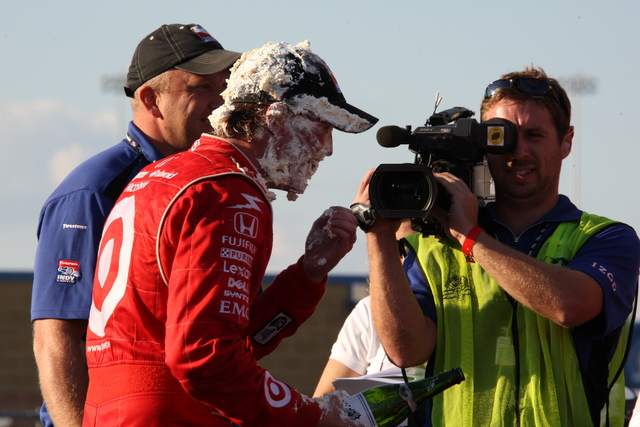 #9 Scott Dixon appears somewhat dazed after having received a cream pie upon winning the series championship. -- Photo by: Dana Garrett