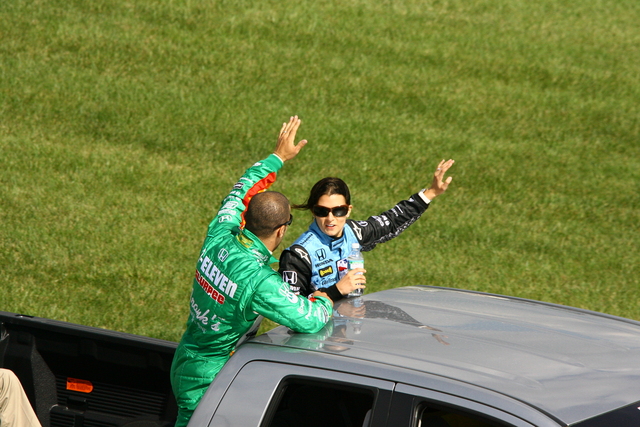 Andretti Green Racing teammates Tony Kanaan and Danica Patrick wave to the crowd before the start PEAK Antifreeze & Motor Oil Indy 300 at Chicagoland Speedway. -- Photo by: Jim Haines