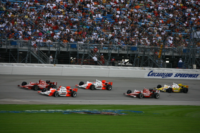 With two laps remaining, both Target Chip Ganassi and Team Penske teammates battle it out. -- Photo by: Jim Haines