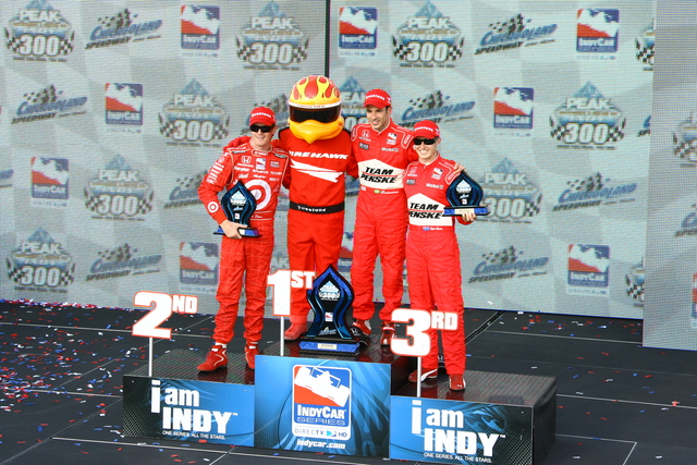 Podium finishers for the PEAK Antifreeze & Motor Oil Indy 300 with Scott Dixon, left, Helio Castroneves, center and Ryan Briscoe, right. -- Photo by: Jim Haines