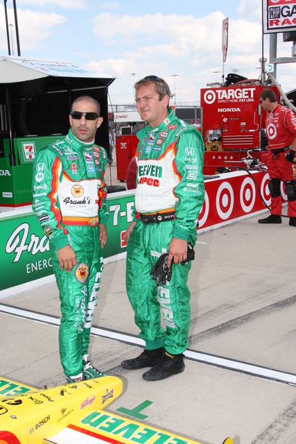 No. 11 Tony Kanaan talks with a crew member before the start of the race at Chicagoland Speedway. -- Photo by: Ron McQueeney