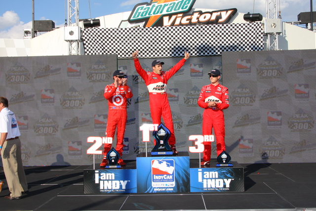 Helio Castroneves wins the PEAK Antifreeze & Motor Oil Indy 300 at Chicagoland Speedway.  Scott Dixon and Ryan Briscoe join him on the podium. -- Photo by: Shawn Payne