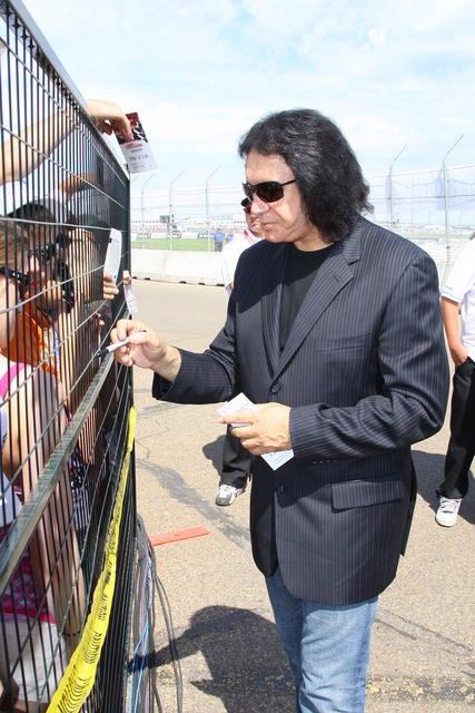 Grand Marshal Gene Simmons, signs autographs for fans before the start of Rexall Edmonton Indy. -- Photo by: Shawn Payne
