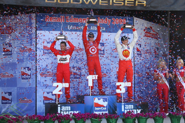 Helio Castroneves, Scott Dixon and Justin Wilson on the podium after the race at Edmonton. -- Photo by: Shawn Payne