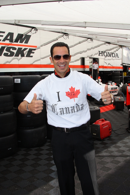 Helio Castroneves shows his support for Canada. -- Photo by: Shawn Payne