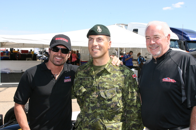 Warrant Officer David Shultz, center, will be the grand marshal of the Rexal Edmonton Indy. He's joined by Alex Tagliani, left, and Ken Knowles, president of event promoter Northlands. -- Photo by: Steve Snoddy