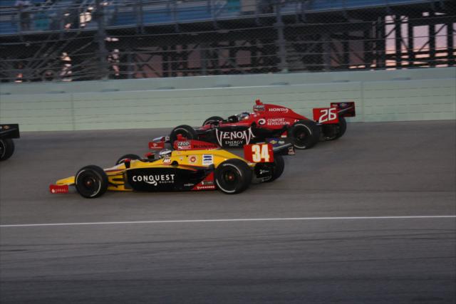 Bertrand Baguette and Marco Andretti duel. -- Photo by: Dana Garrett