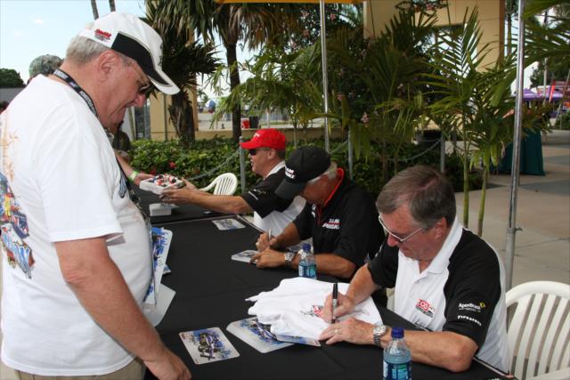 Johnny Rutherford and other greats sign autographs. -- Photo by: Dana Garrett