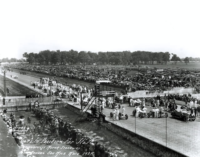 The starting field and Marmon Pace Car on the track at the Indianapolis Motor Speedway  before the start of the 1928 Indianapolis 500. -- Photo by: No Photographer