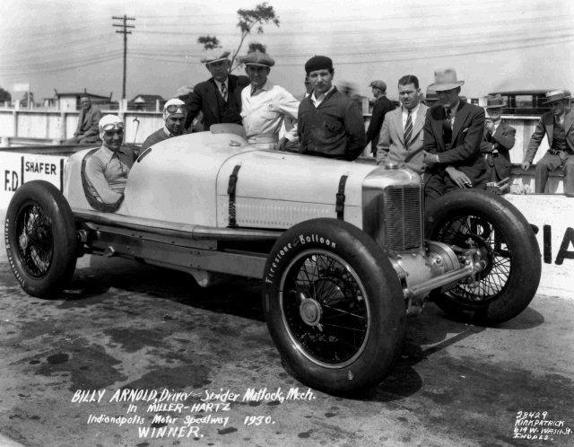1930 winner Billy Arnold with riding mechanic Spider Matlock sitting in the winning Miller-Hartz Special Summers/Miller with the crew. -- Photo by: No Photographer