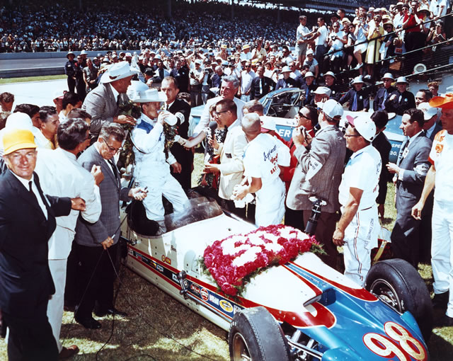 Parnelli Jones with car owner J.C. Agajanian and crew in Victory Circle after winning the 1963 Indianapolis 500 at the Indianapolis Motor Speedway.  -- Photo by: No Photographer