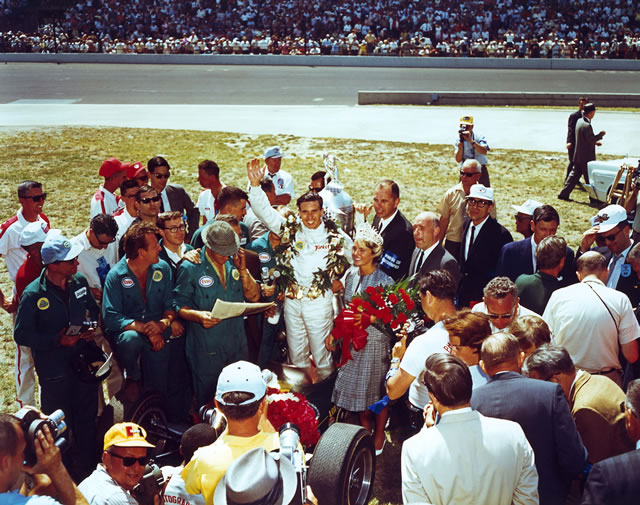 1965 Indianapolis 500 winner Jim Clark celebrating in victory lane with crew. -- Photo by: No Photographer