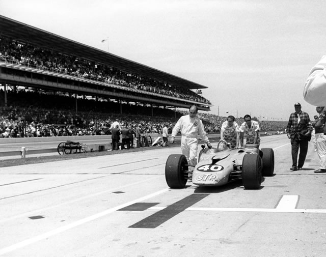 Parnelli Jones, #40, STP Oil Treatment, Granatelli, Pratt & Whitney pushing car back to garage after dropping out of the 1967 Indianapolis 500. -- Photo by: No Photographer