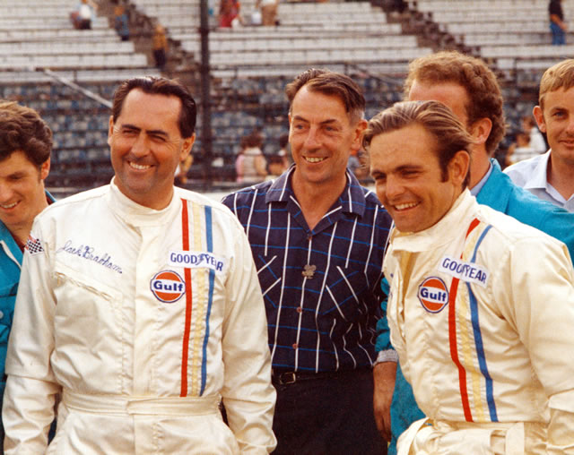 Peter Revson (R) and Jack Brabham (L) with crew. -- Photo by: No Photographer