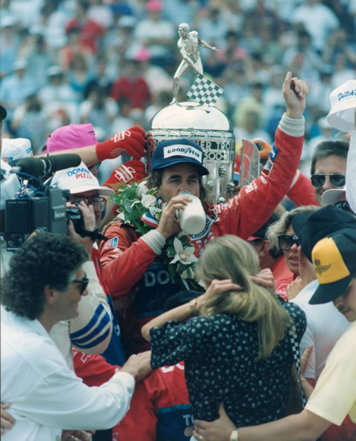 Arie Luyendyk drinks milk in Victory Circle after winning the 1990 Indianapolis 500 at the Indianapolis Motor Speedway -- Photo by: No Photographer
